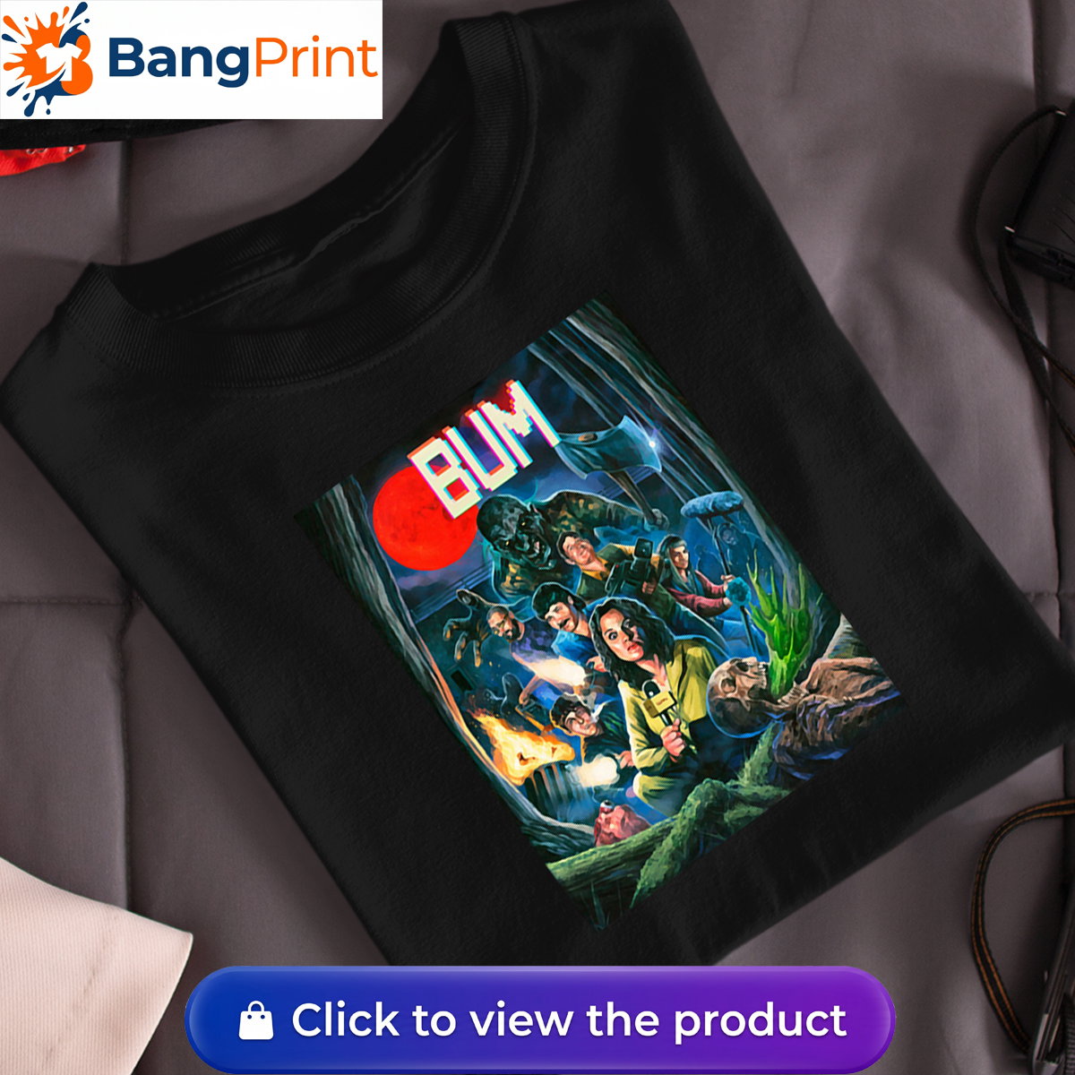 Black cotton t-shirt featuring a retro horror-inspired graphic of a news crew and monsters under a blood moon with the stylized text "BUM".