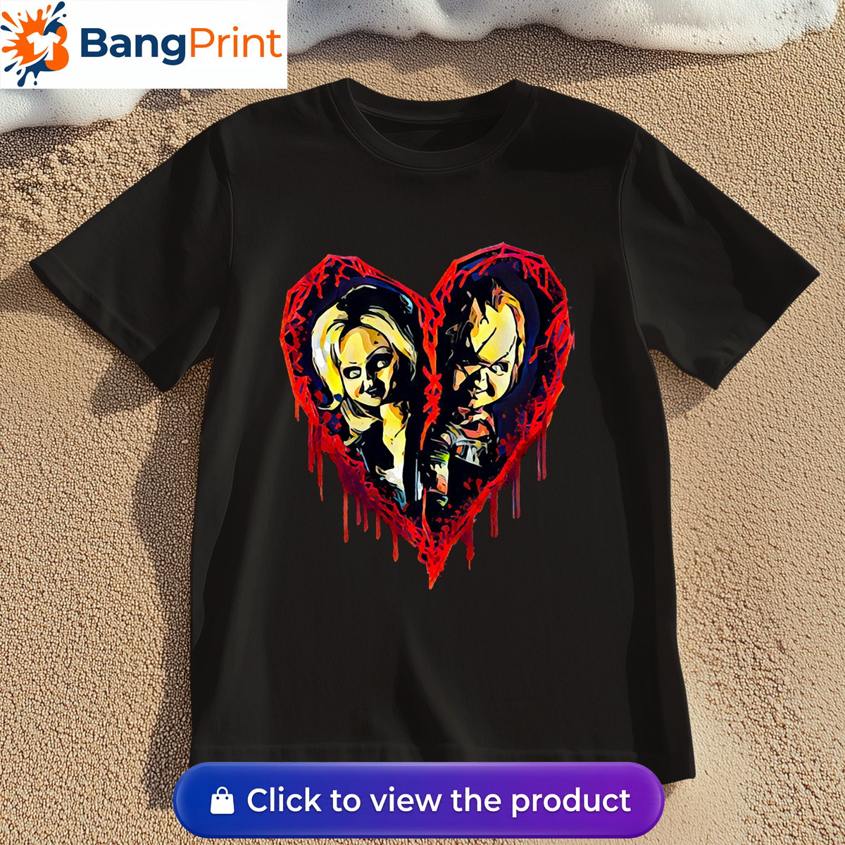 Black short-sleeve t-shirt displaying a graphic of a broken, dripping red bloody heart containing the stylized faces of horror movie characters Chucky and Tiffany.
