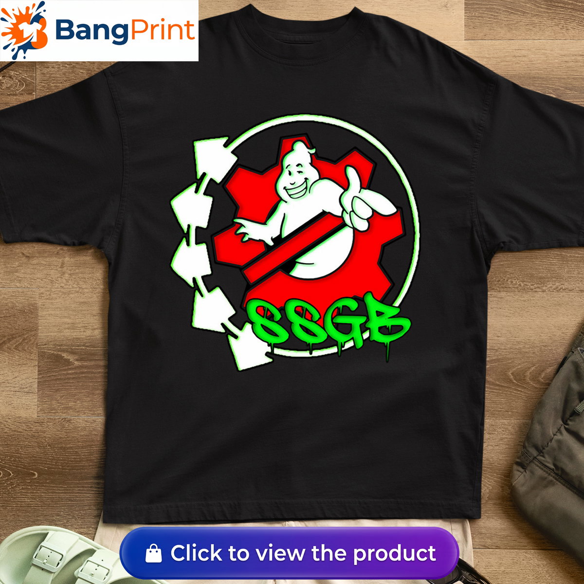 Black t-shirt featuring a white ghost character inside a red gear, surrounded by neon green arrows and SSGB graffiti dripping text.